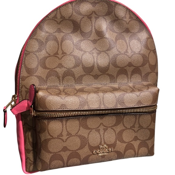 coach backpack brown and pink Mini Court Colorblock Leather Small Bag Red Orange Luxe Fashion Finds Refined pebble leather Inside zip and multifunction pockets Zip closure fabric lining Top handle with 2 1/2 drop Outside zip pocket Adjustable shoulder straps 12 (L) x 14 3/4 (H) x 5 (W) Style No. available today #coach #girly